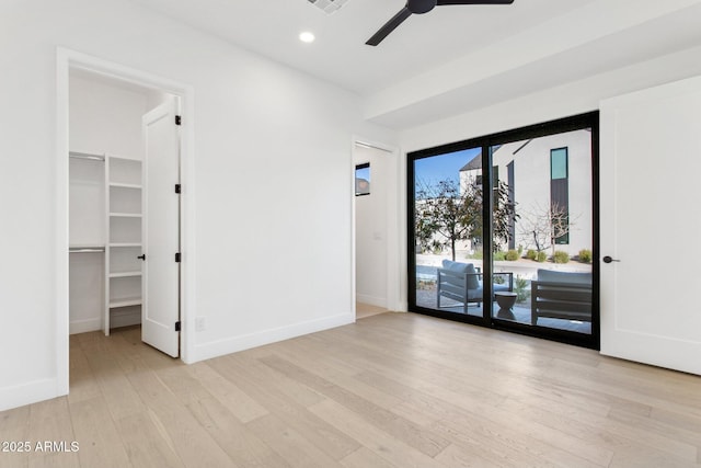 spare room featuring ceiling fan and light hardwood / wood-style floors