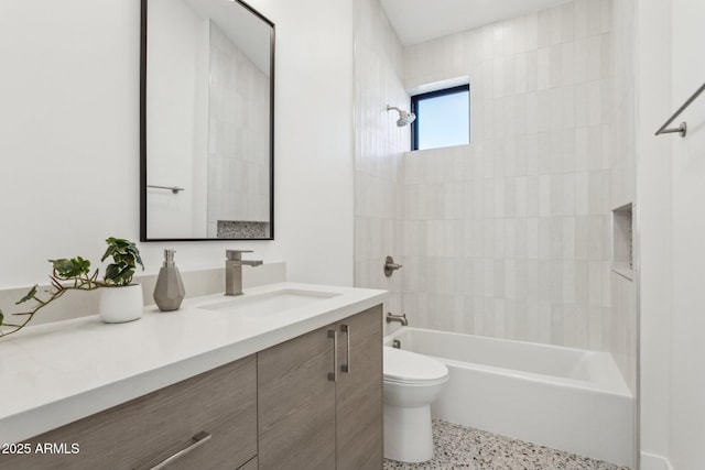 full bathroom with tiled shower / bath combo, vanity, and toilet