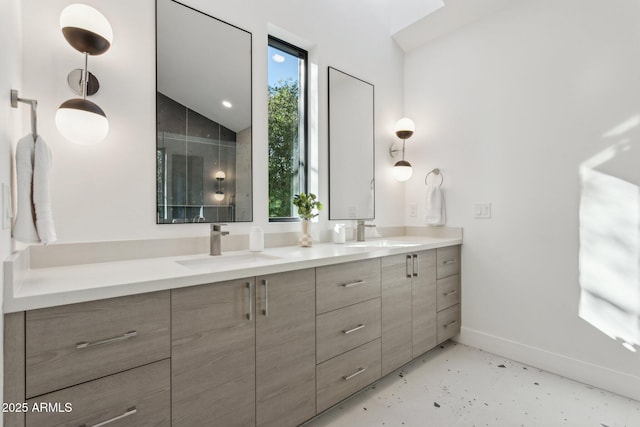 bathroom featuring vanity, concrete flooring, and vaulted ceiling