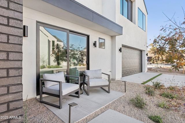 exterior space with a garage and a patio