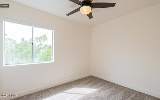 unfurnished room featuring carpet flooring and ceiling fan