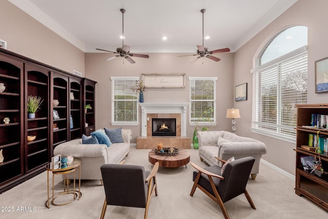 living area with crown molding, recessed lighting, light colored carpet, a tile fireplace, and baseboards