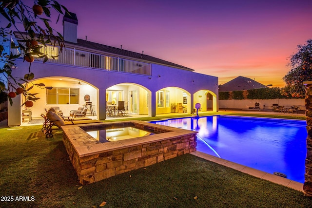 view of pool with outdoor dining area, an in ground hot tub, fence, a fenced in pool, and a patio area