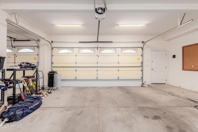 garage featuring a garage door opener