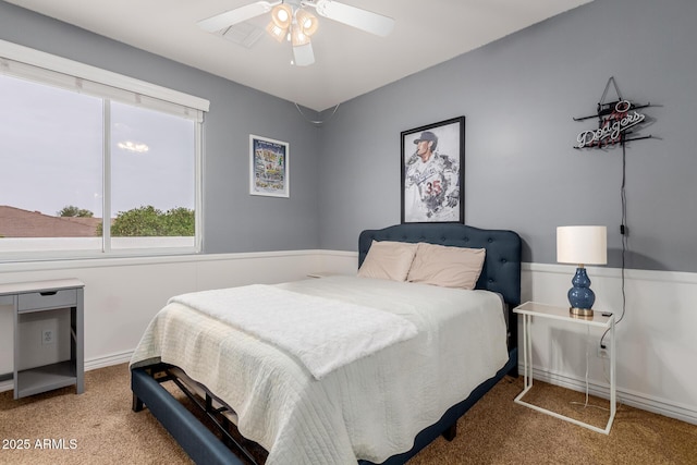 carpeted bedroom with a ceiling fan