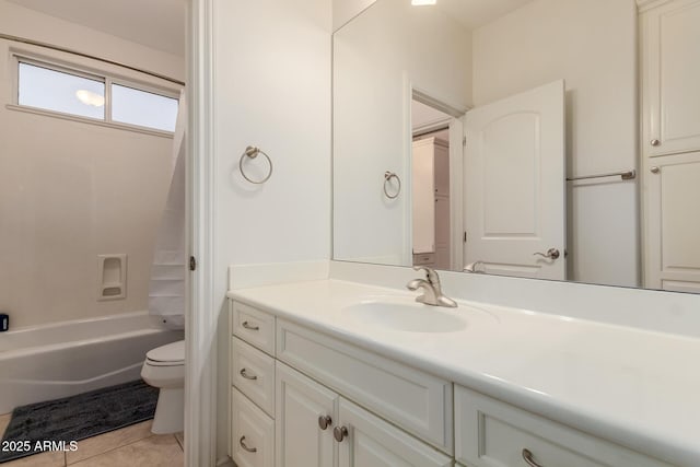 bathroom with washtub / shower combination, vanity, toilet, and tile patterned floors