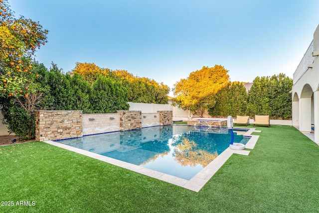 outdoor pool with a fenced backyard and a yard