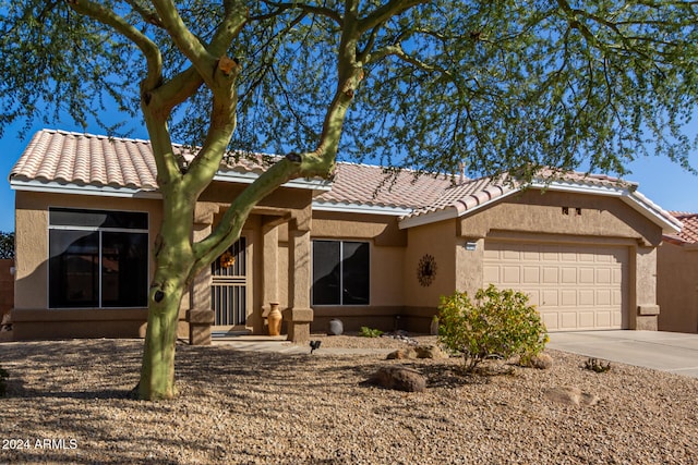 ranch-style home with a garage