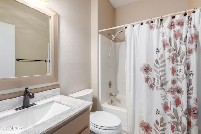 full bathroom featuring shower / tub combo, vanity, and toilet