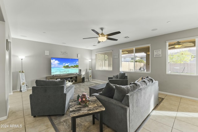 tiled living room featuring ceiling fan