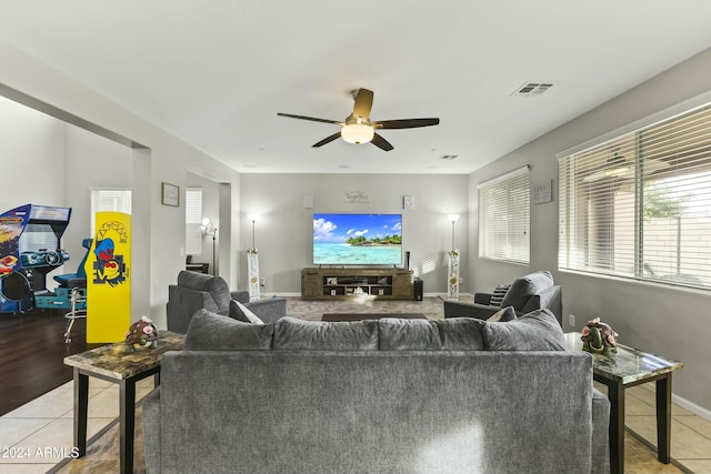 living room with ceiling fan and light tile patterned floors