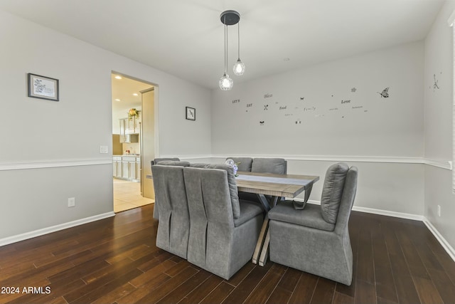 dining area featuring dark hardwood / wood-style floors