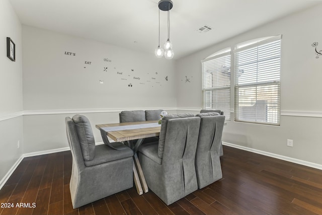 dining area with dark hardwood / wood-style flooring