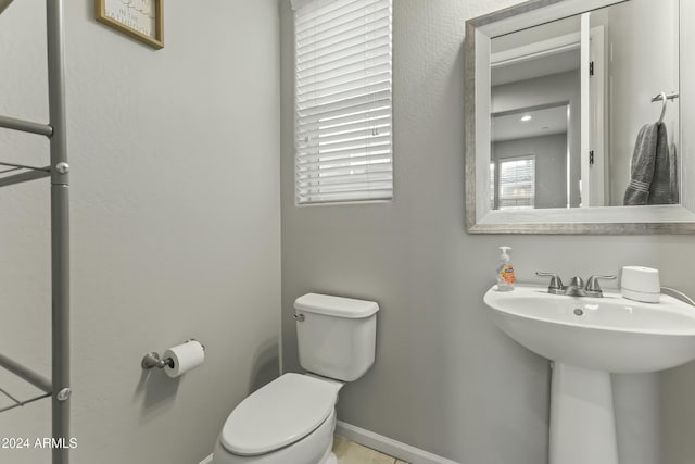 bathroom with toilet and sink