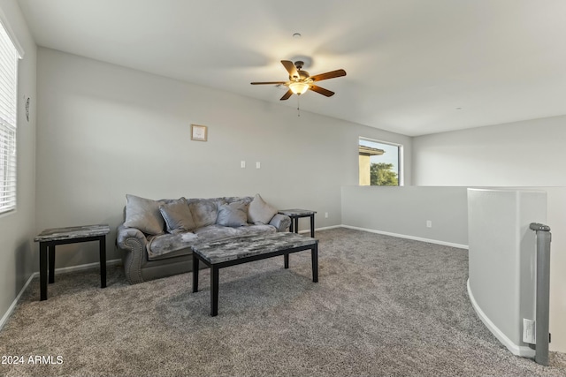 carpeted living room featuring ceiling fan