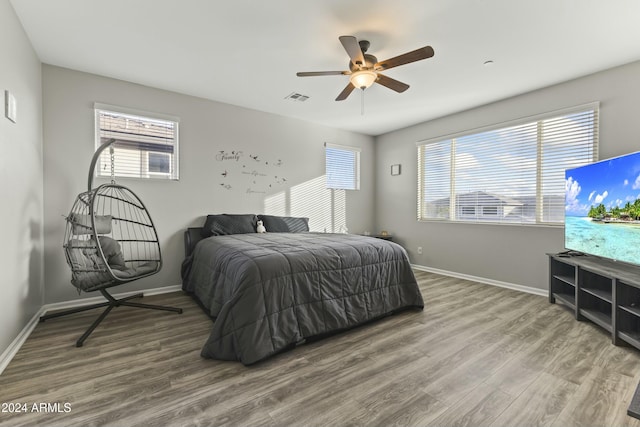 bedroom featuring wood-type flooring and ceiling fan