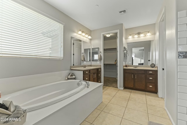 14575 W Orange Dr, Litchfield Park, AZ 85340 - full bathroom with a bath, tile patterned floors, vanity, and a spacious closet