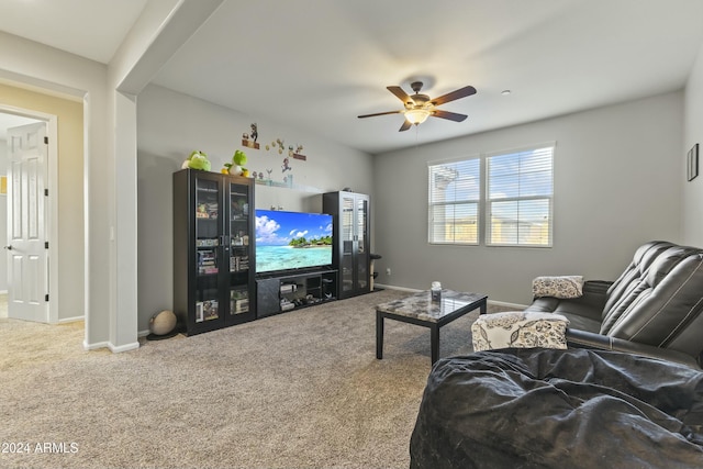 carpeted living room with ceiling fan