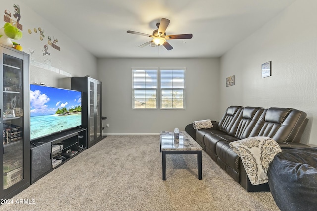 carpeted living room featuring ceiling fan