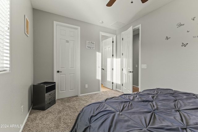 carpeted bedroom featuring ceiling fan