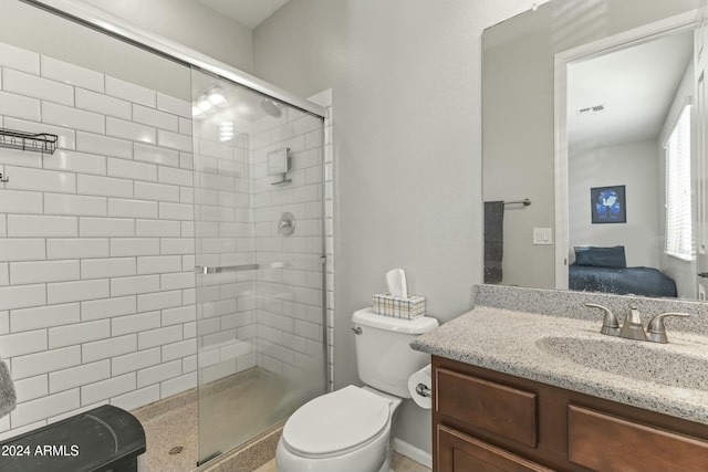 bathroom with vanity, toilet, and walk in shower