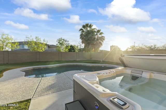 14575 W Orange Dr, Litchfield Park, AZ 85340 - view of pool with a hot tub, a fenced backyard, and a patio area