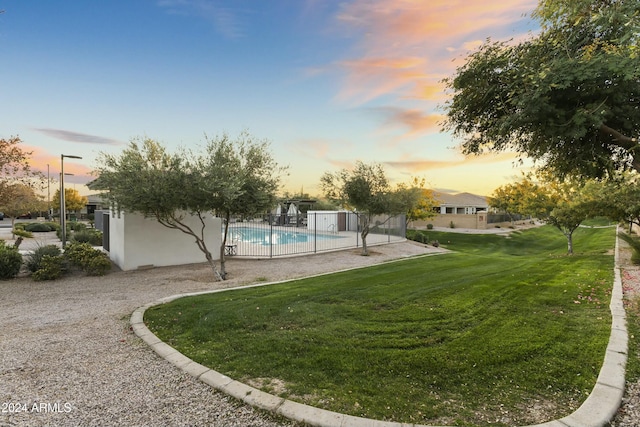 yard at dusk with a patio area