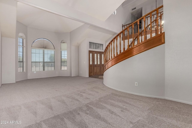 unfurnished living room with carpet