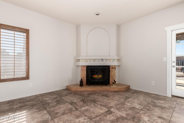 unfurnished living room featuring a fireplace