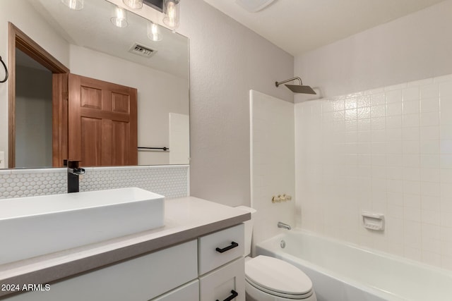 full bathroom with backsplash, shower / washtub combination, vanity, and toilet