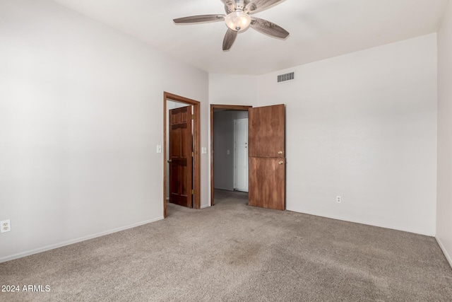 carpeted empty room with ceiling fan