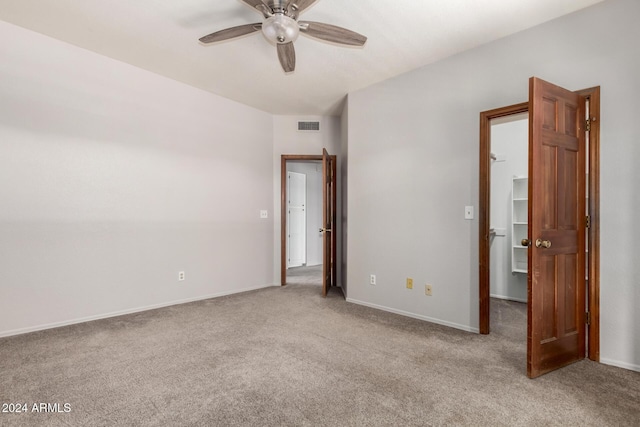 carpeted empty room with ceiling fan