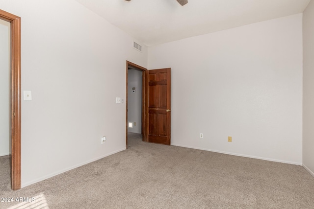 carpeted empty room with ceiling fan