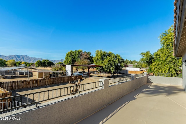 view of patio / terrace featuring a mountain view