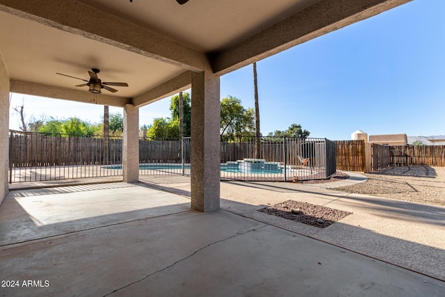 view of patio with a fenced in pool and ceiling fan