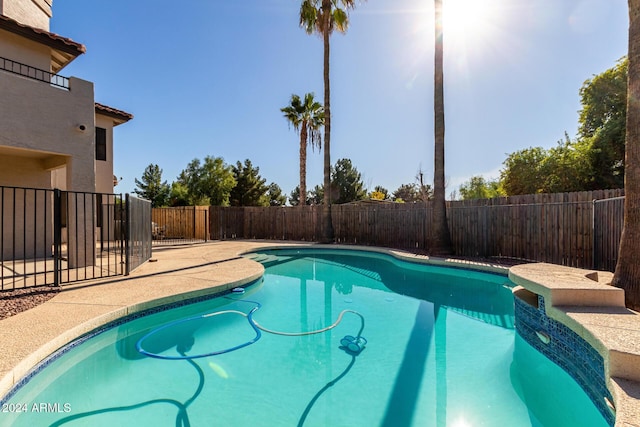 view of swimming pool featuring a patio