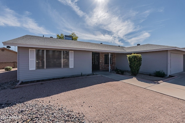 single story home featuring a garage