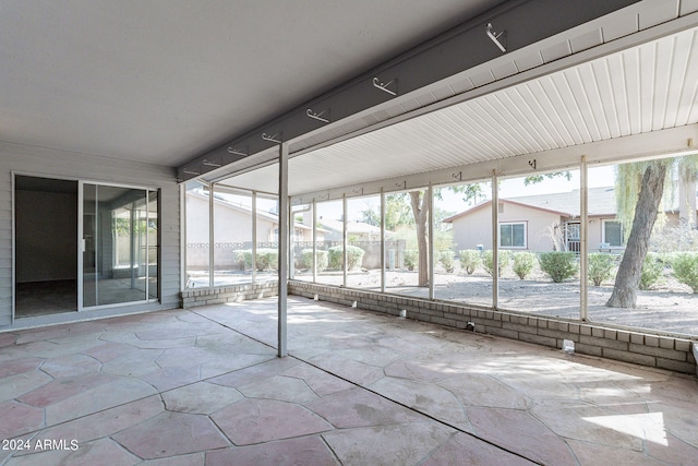 unfurnished sunroom with plenty of natural light