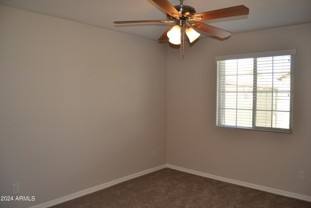 unfurnished room with carpet and ceiling fan