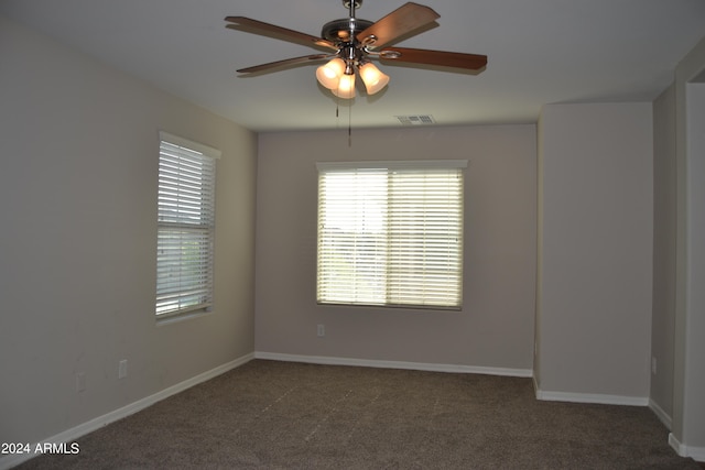 spare room with ceiling fan and carpet flooring