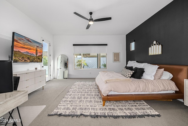 bedroom featuring ceiling fan and light carpet