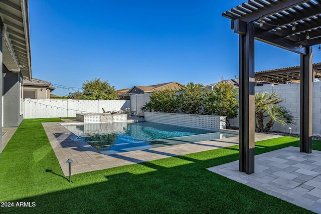 view of pool with a lawn, a patio area, and a pergola