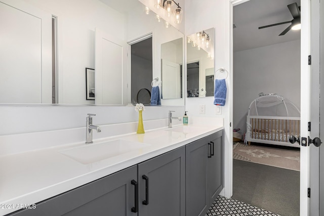 bathroom featuring tile patterned floors, ceiling fan, and vanity