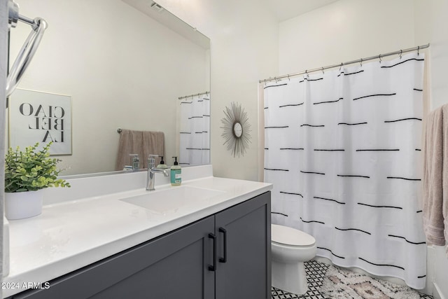 bathroom featuring walk in shower, vanity, and toilet