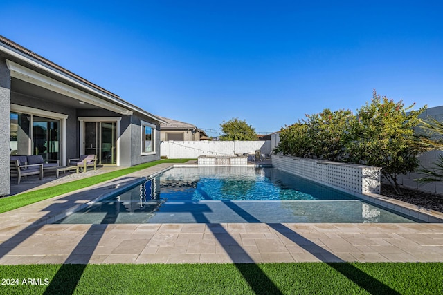 view of swimming pool with a patio area and pool water feature