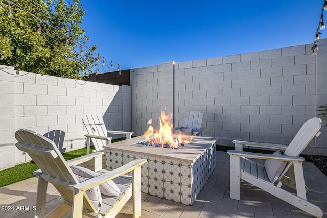 view of patio / terrace with an outdoor fire pit