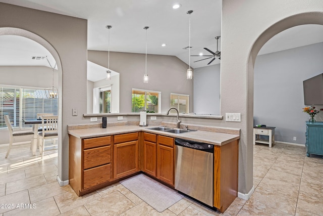 kitchen featuring vaulted ceiling, decorative light fixtures, dishwasher, sink, and ceiling fan