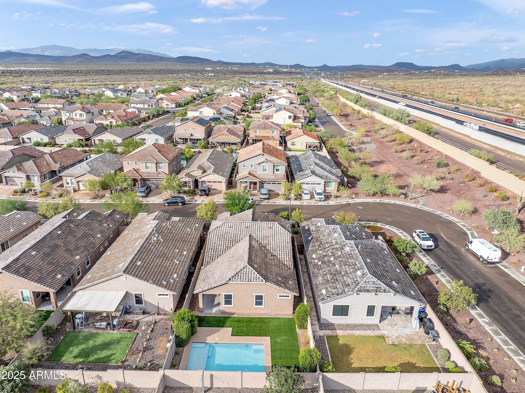 birds eye view of property with a mountain view