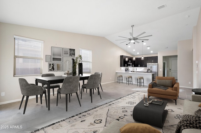 living room featuring ceiling fan and lofted ceiling