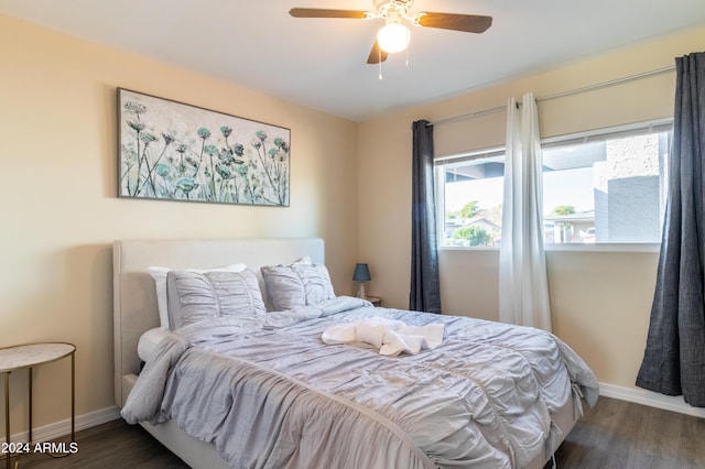 bedroom featuring ceiling fan and dark wood-type flooring